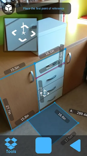 AR Meter measuring wooden dresser with drawers displaying multiple dimensions 15.5m 6.4m 21.7m 16.5m using blue augmented reality measurement lines