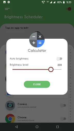 Calculator app brightness configuration dialog with auto brightness and adjustable brightness level slider