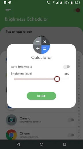 Calculator brightness settings dialog with auto brightness disabled and brightness level slider at 200 adjustment