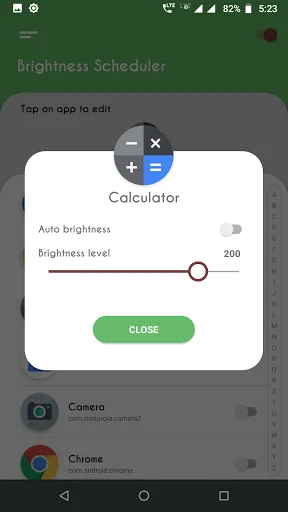 Calculator app brightness settings dialog with auto brightness toggle switch and brightness level slider set to 200