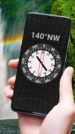 Accurate Compass mobile app held in hand showing 140°NW bearing with scenic waterfall background