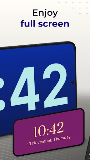 Full screen digital clock view showing time 10:42 with date 19 November Thursday