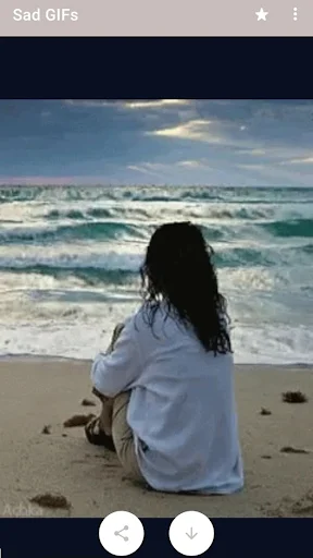 Sad GIF preview showing person sitting alone on beach looking at ocean waves with action buttons